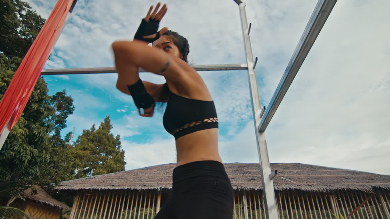 Woman Training Muay Thai Outdoors