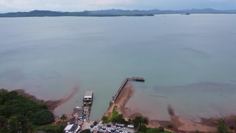 AERIAL:-Cars-are-Taking-the-Ferryboat-from-Koh-Chang-Island-to-Mainland,-Trat,-Thailand,-Asia