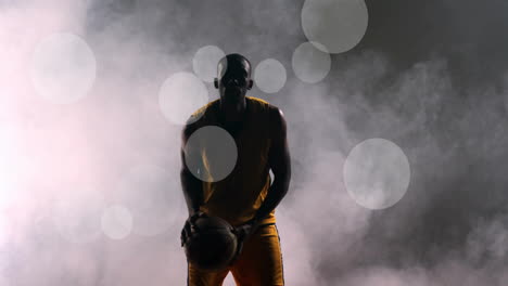 animación de un jugador de baloncesto afroamericano lanzando una pelota y puntos de luz sobre un fondo negro