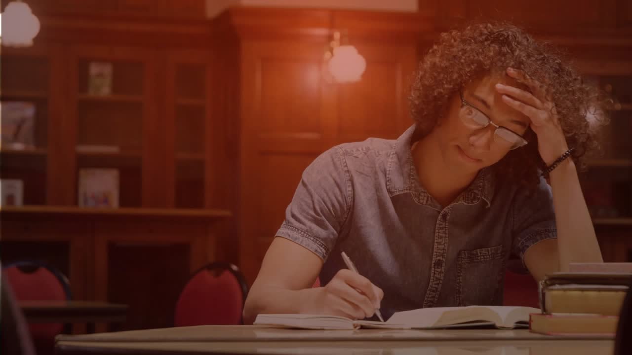 Man studying in library with HUD appearing, pulsing over open book while occluding view, writing