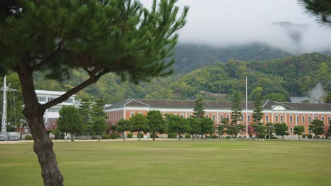 establishing shot of etajima jmsdf naval academy officers training building