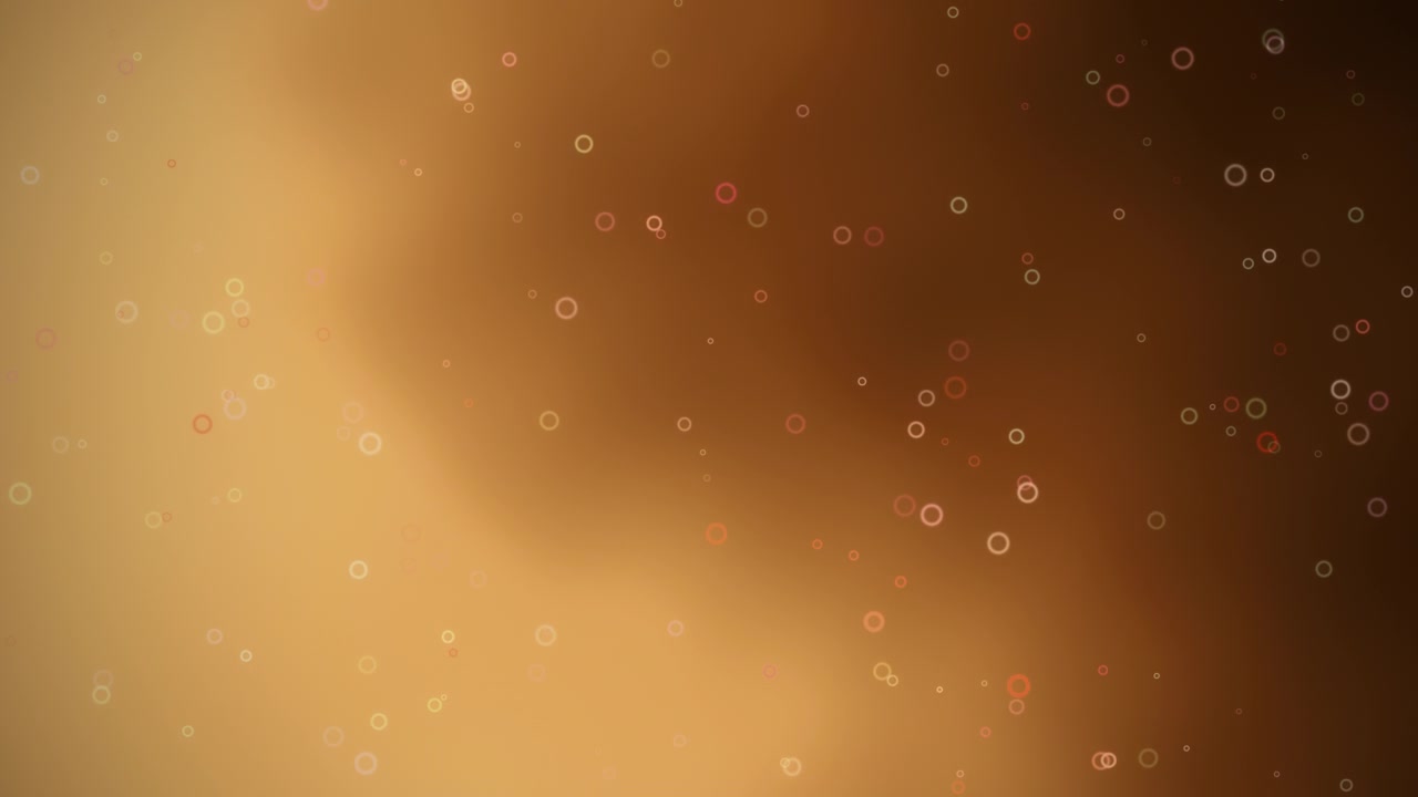 Sfondo astratto con cerchi bokeh dorati e un bagliore caldo e festoso