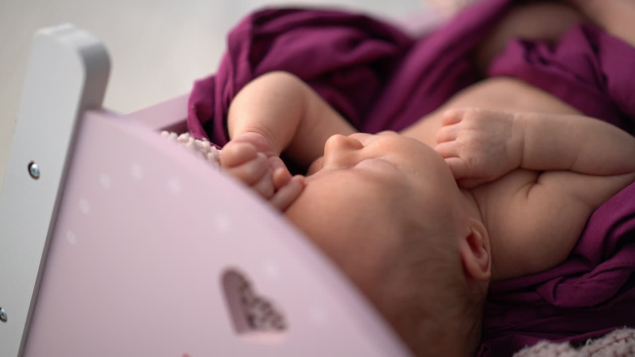 A sleeping newborn baby