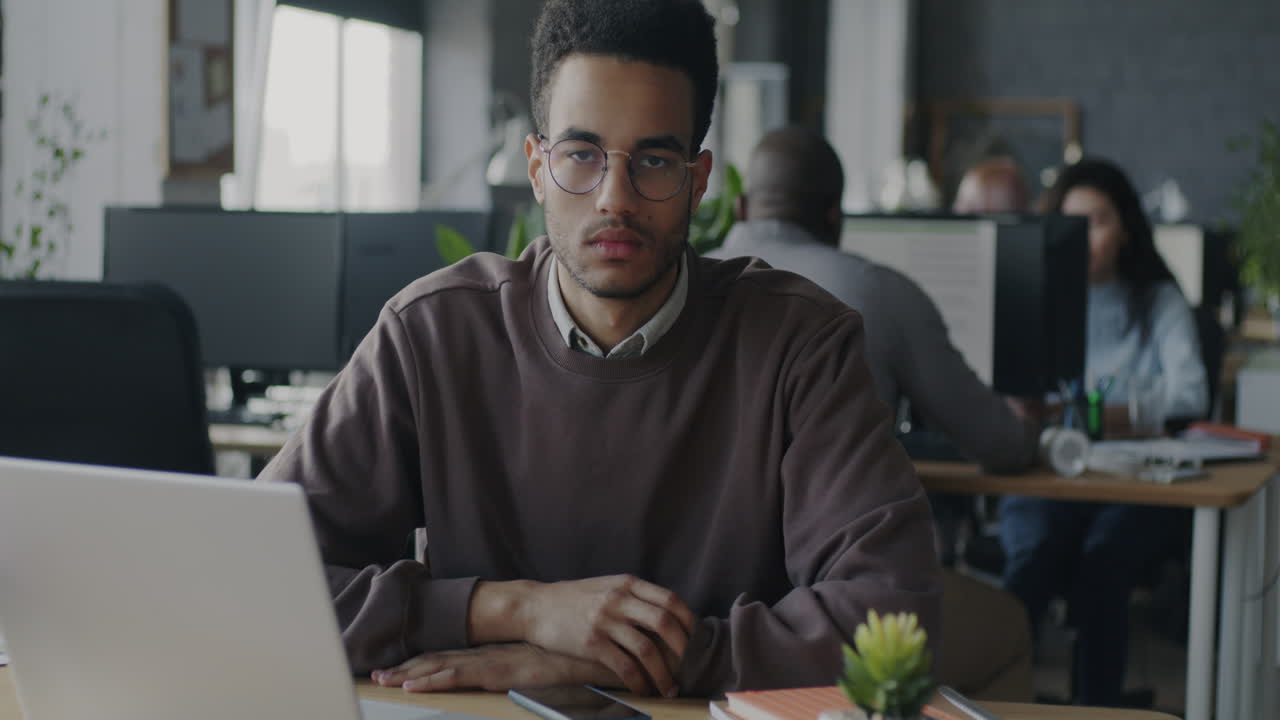Man sitting at a desk in an office