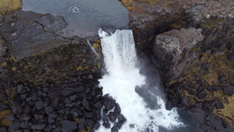 iceland waterfall: aerial view of oxarafoss