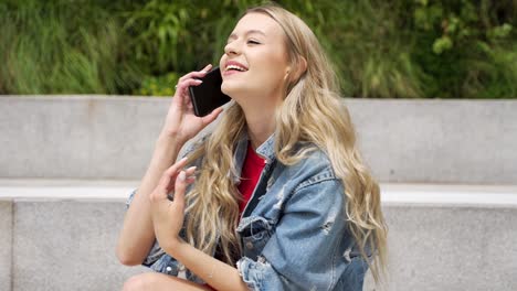 young woman talking on phone outdoors