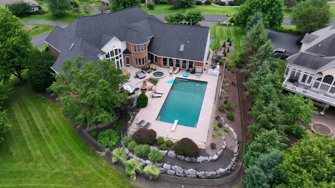 Upper class neighborhood with Victorian villas and pool in garden. Aerial top down. Quiet and peaceful atmosphere in wealthy suburb residential area of America