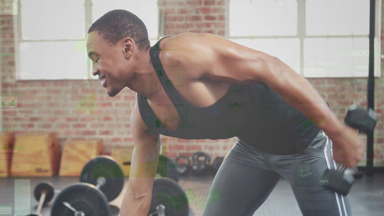 Male trainee gripping dumbbell, bracing support, rowing reps in gym, for strength, resting, smiling