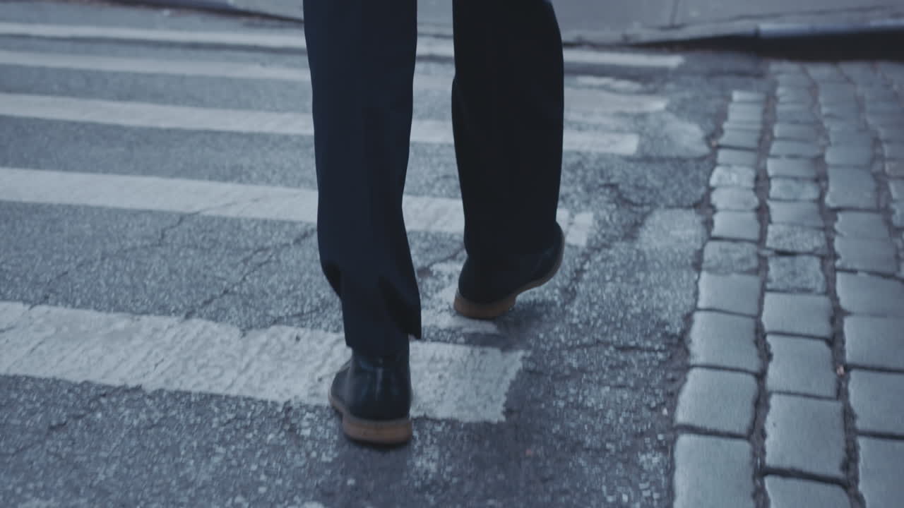 A person is crossing the street