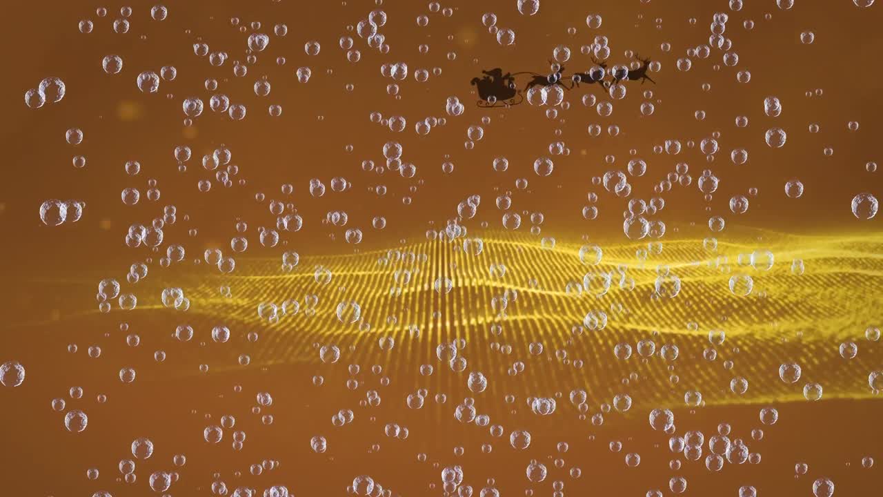 Animation of bubbles and light spots over santa claus in sleigh with reindeer on orange background