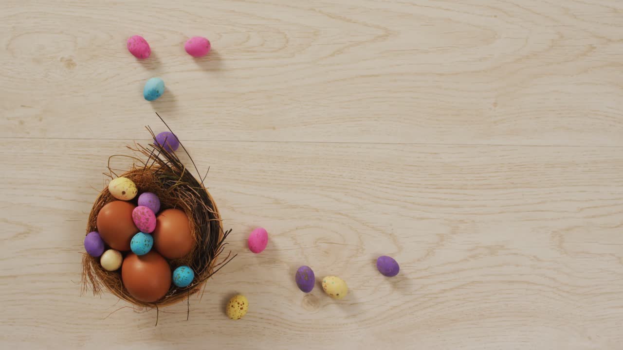 Video of decorated colorful easter eggs on a wooden surface