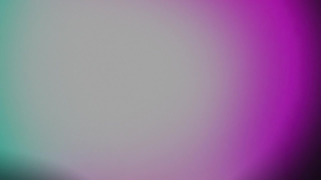 Abstract Motion Background with Soft Purple and Green Light Leaks