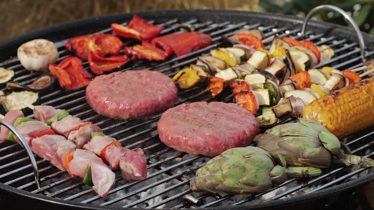 Traditional spanish barbeque, big sausage chorizo botifarra, pork and beef ribs on grill with fire, american style cooking, chef grilling meat fat food, steaks and sausages on bbq. High quality 4k footage