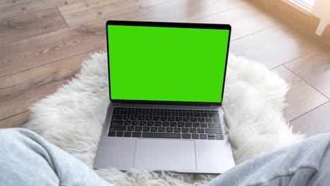 green screen laptop computer sitting on a home work