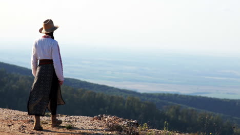 Romanian-girl-walks-over-the-hills-and-admires-the-view-2