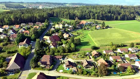 Drone-Flight-Over-Rural-Kräiligen-with-the-Jura-Mountains-in-the-Background-Switzerland