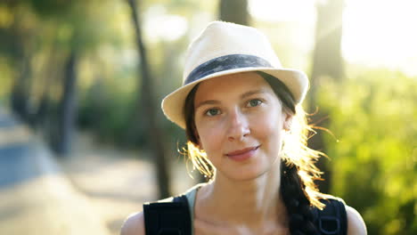 woman in a hat in a forest