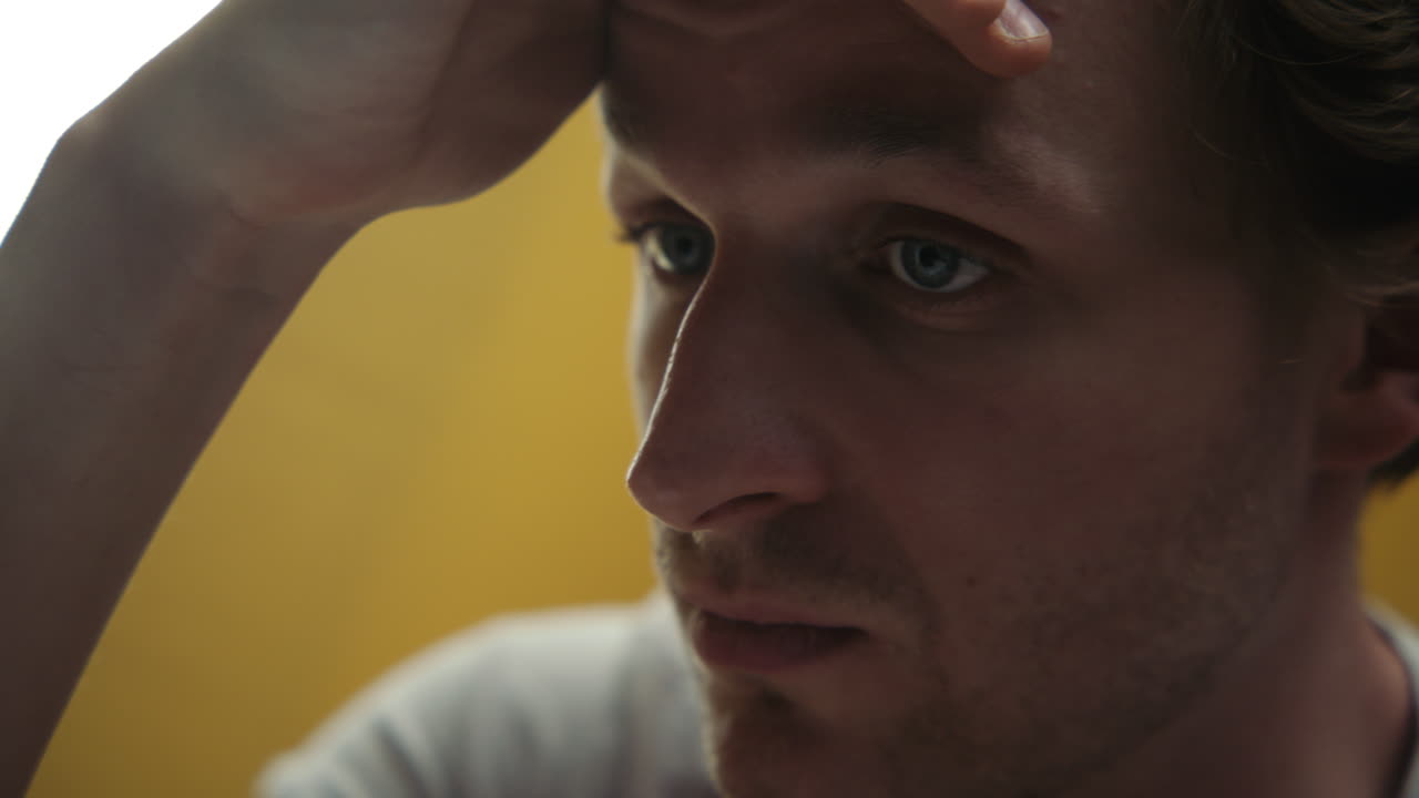 Close-up portrait of a pensive man