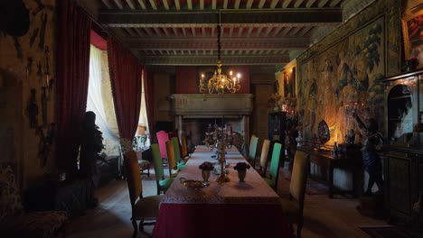 Slow-dolly-shot-of-an-antique-dining-table-within-a-chateau-in-France