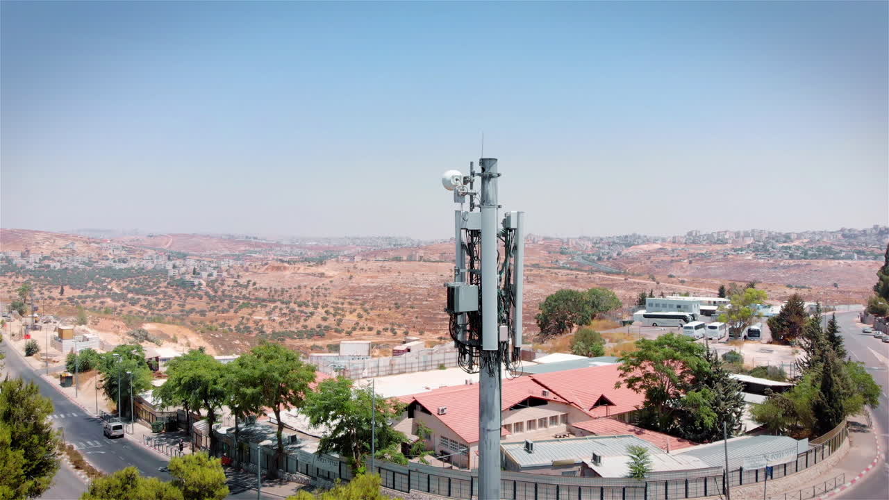 Celular Antenna close to Populated neighbourhood area aerial view
