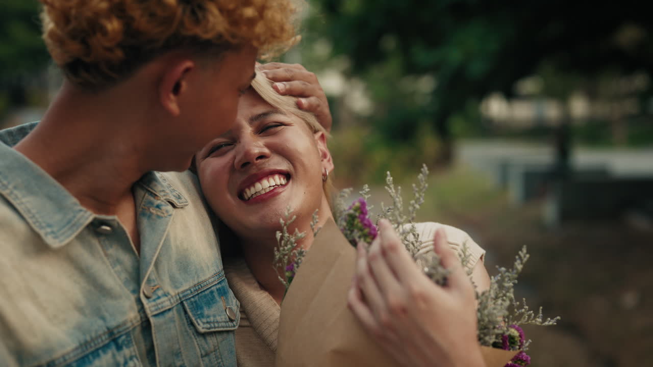 Affectionate LGBTQ+ Couple Enjoying a Romantic Moment with Flowers