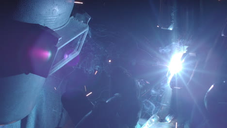 man welding steel in slow motion