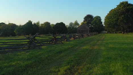 From-fence-to-barn-and-over-the-trees-near-the-Joseph-Smith-family-farm,-frame-house,-temple,-visitors-center,-and-the-sacred-grove-in-Palmyra-New-York-Origin-locations-the-book-of-Mormon