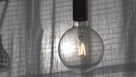 stylish minimalist bulb close up, living room interior detail