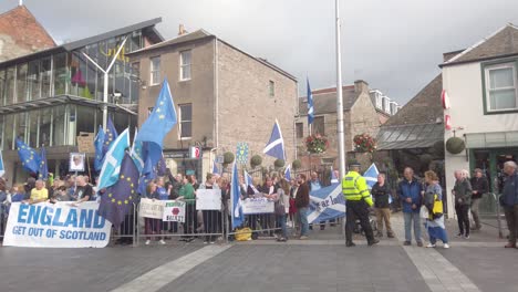 scottish protesters and their flags outside the perth concert hall where the tory leadership hustings is being held.