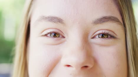 Portrait-of-a-happy-caucasian-teenager-girl-at-home,-slow-motion