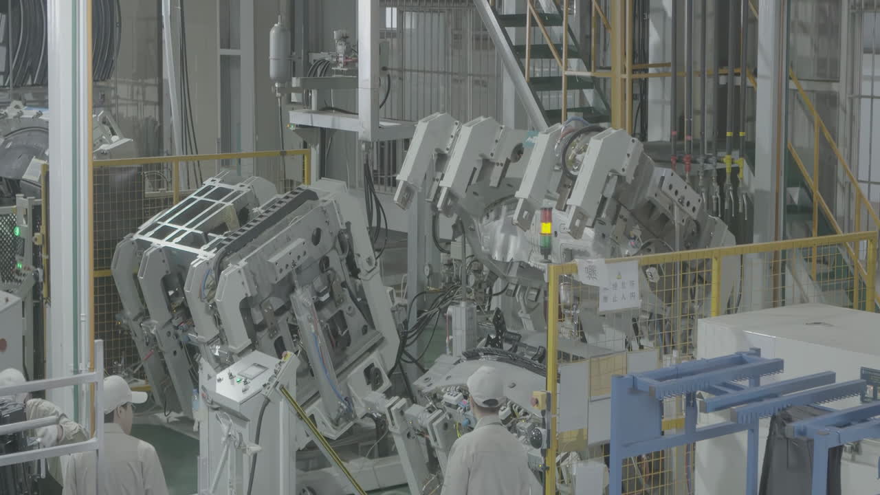 Industrial car bodies are moving on conveyor, robotic production in automobile factory, stamping metal machine semi auto feeding steel sheet for car parts in factory or garage