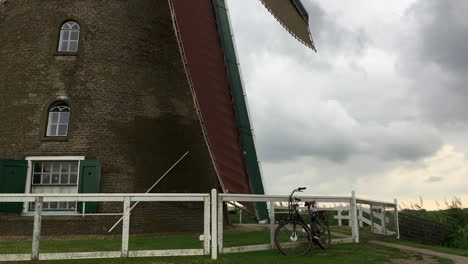 Spinning-low-angle-windmill-blades-at-Kinderdijk,-Amsterdam,-Holland,-The-Netherlands,-HD