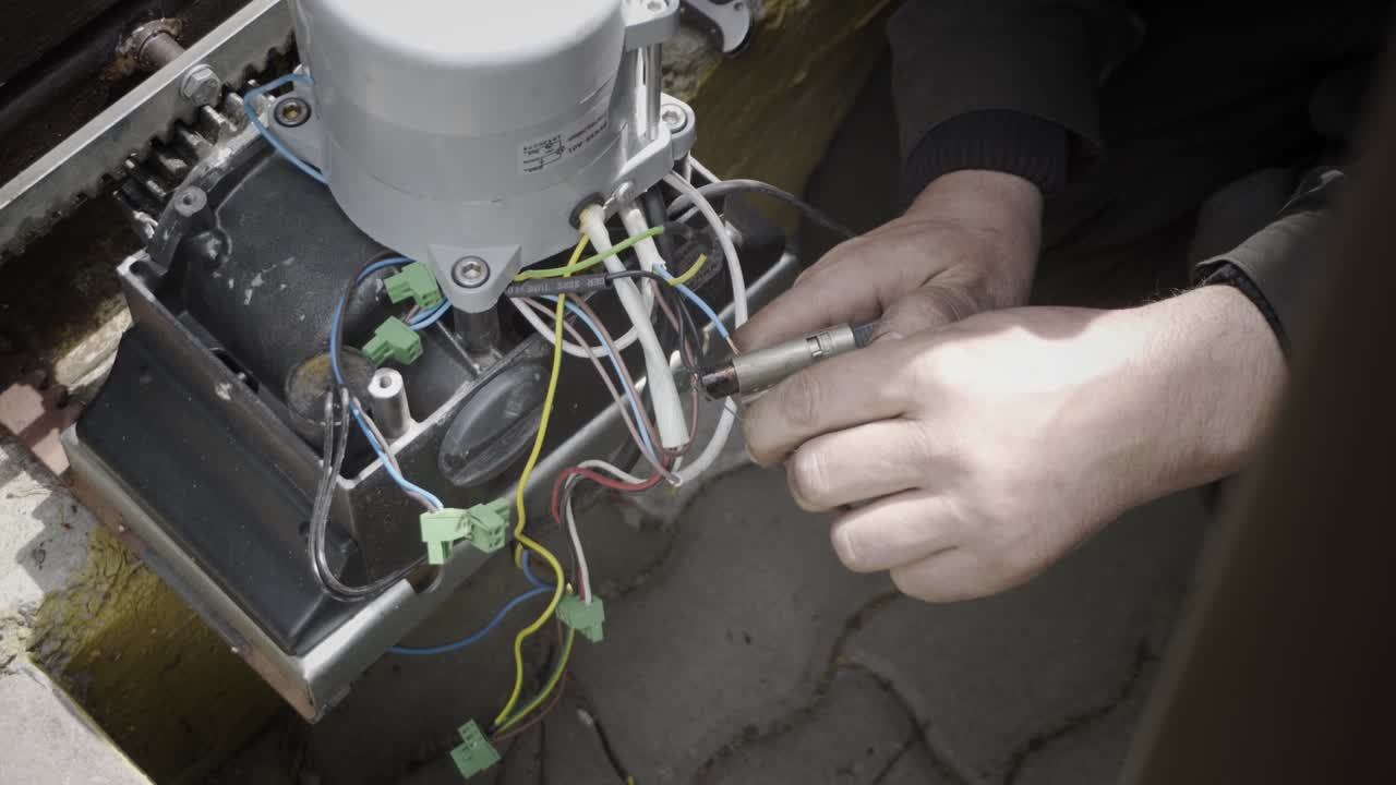 Soldering wires with a gas soldering iron, close-up.