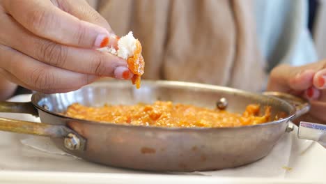 woman eating menemen