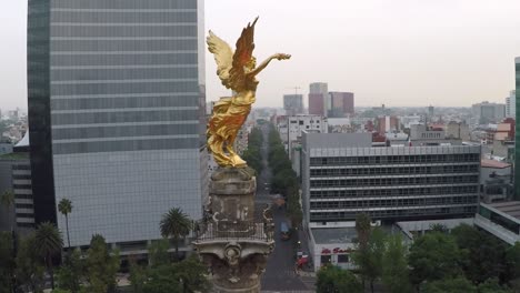 Lateral-aerial-view-of-Angel-of-Independence-in-Reforma,-Mexico