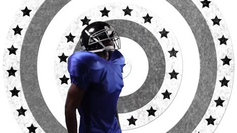 african american male rugby player wearing a helmet against stars on spinning circles