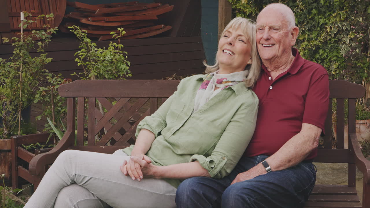Happy Elderly Couple Relaxing on a Bench