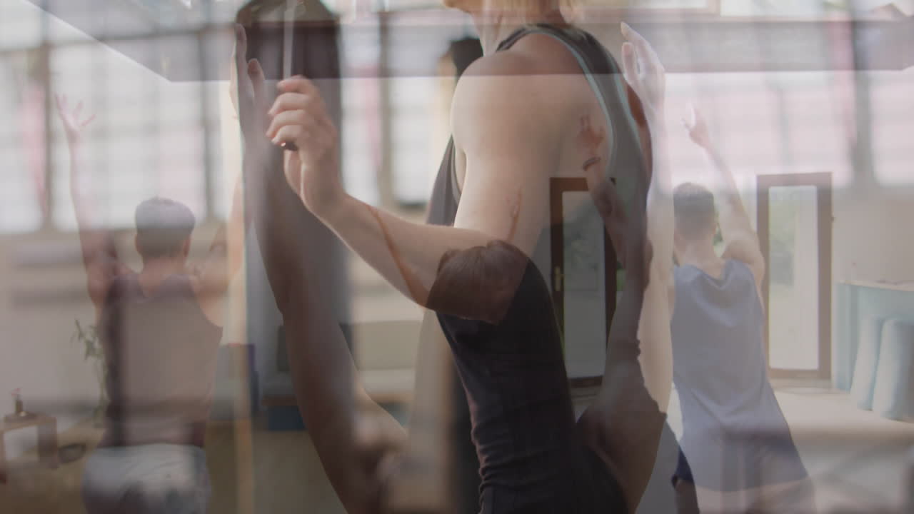 In studio, people practicing ballet with animation overlay of dancers in motion