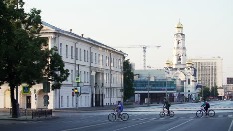 city street scene with cyclists and church