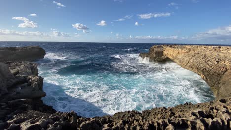 Waves-crashing-on-rocky-coastline-of-Gozo,-Malta,-slow-motion