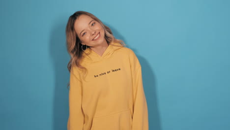 smiling woman in yellow hoodie