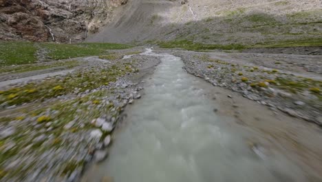 flying low over rough and rugged terrain of fellaria glacier in valmalenco, valtellina in italy