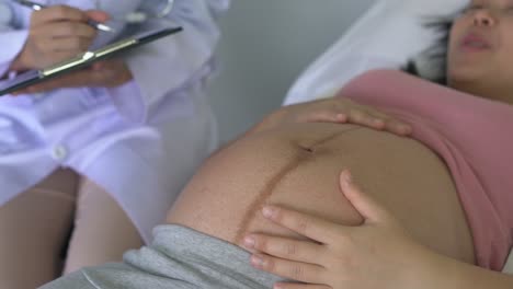 pregnant woman and gynecologist doctor at hospital