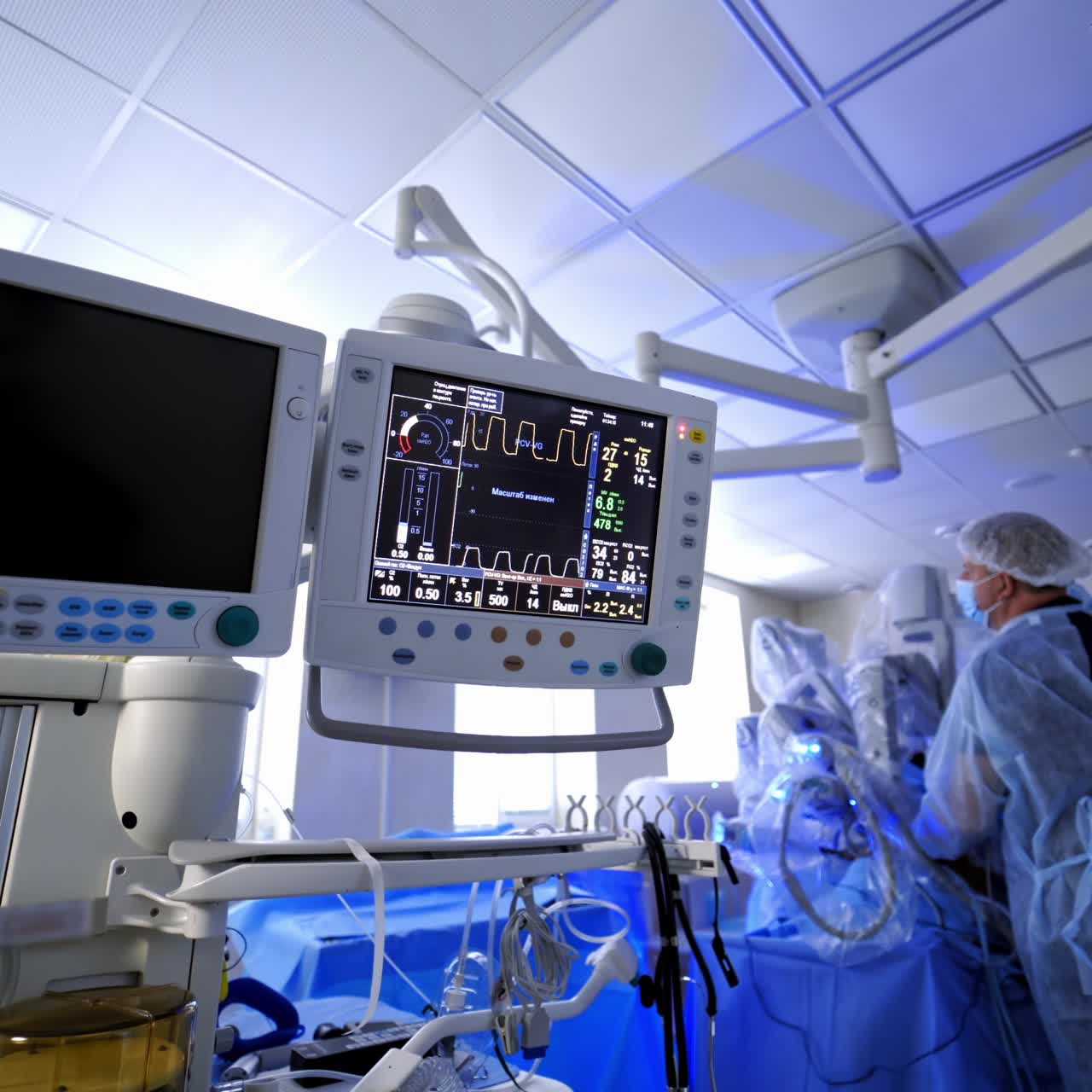 Medical equipment during robotic surgery. Monitor shows the patient's condition in modern hospital. Doctor uses da vinci system in surgical room.