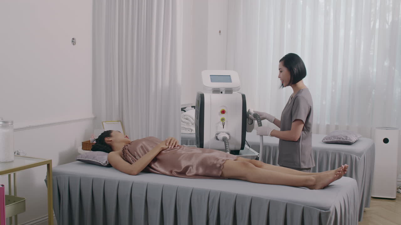 Client Getting Laser Epilation on Legs in Salon