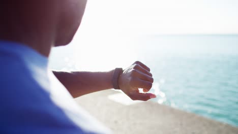 close up ethnic male smart watch sun flare