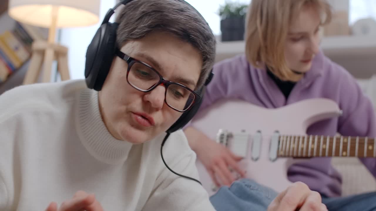 Mother and Daughter Learning Music Together at Home