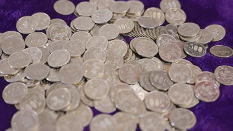 500 yen coins, thousands of dollars in japanese currency