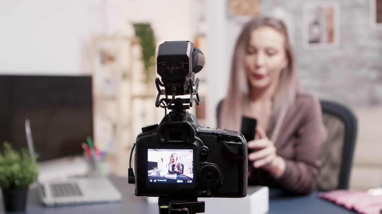 Vlogger recording a video with a camera
