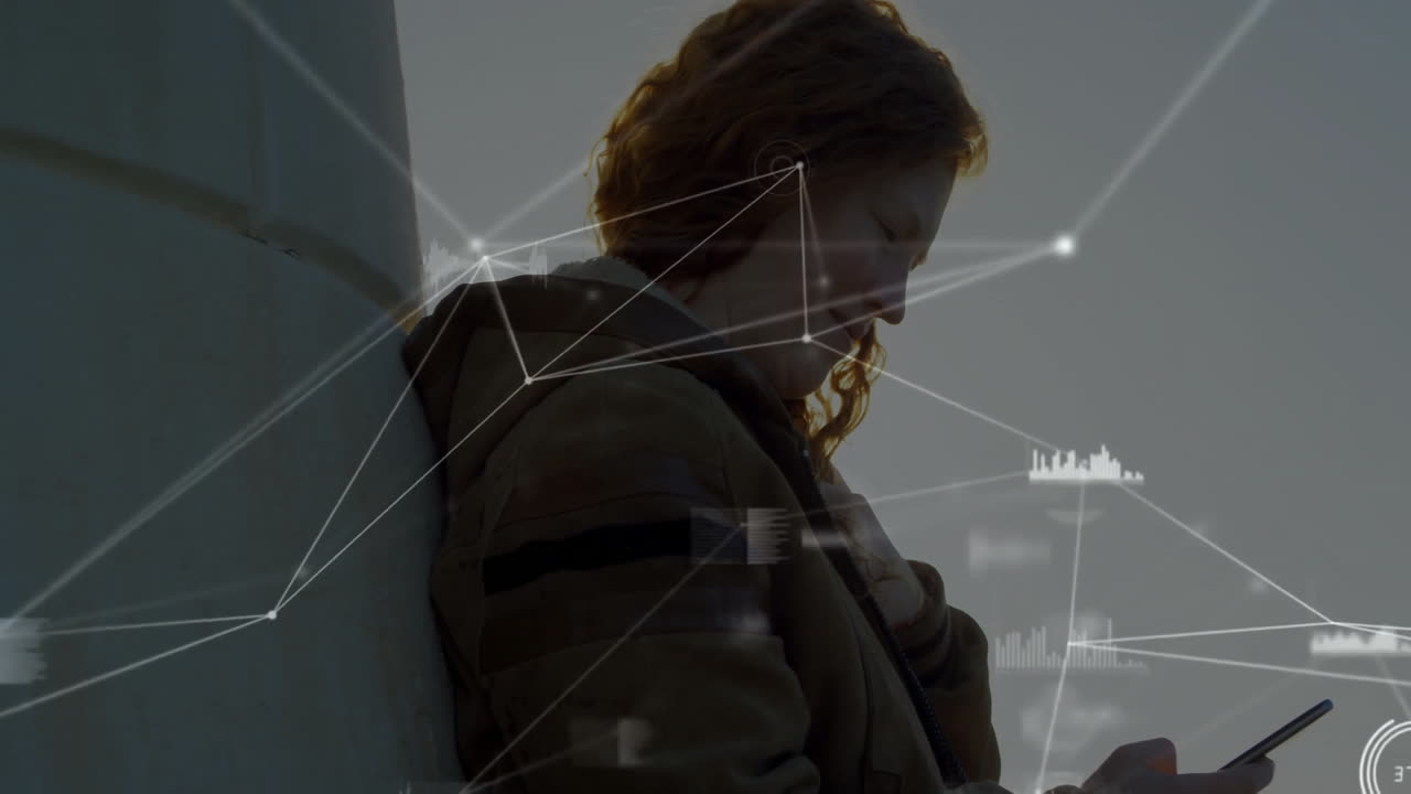Using phone, woman leaning against wall with digital network animation overlay